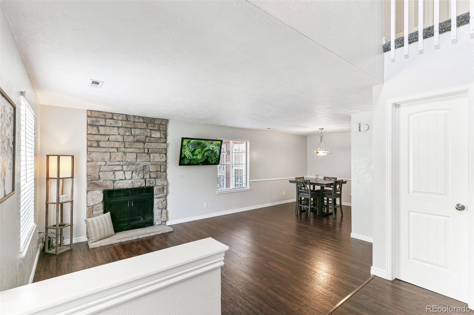 8417 Everett Way, Unit C Arvada, CO 80005 - Photo 7 of 34 a view of a livingroom with furniture and a fireplace