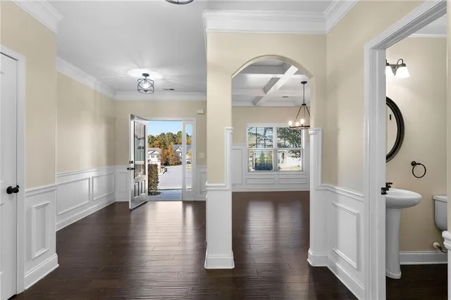 a view of a hallway view with wooden floor and staircase