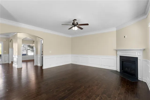 wooden floor in an empty room with a fireplace