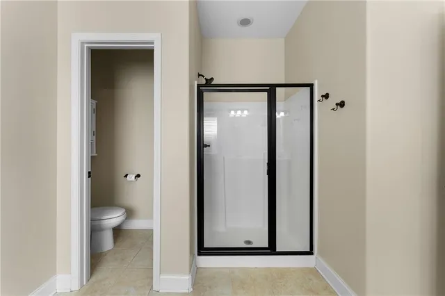 a view of a bathroom with a glass door