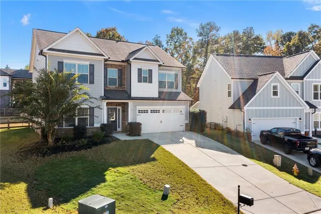 a front view of a house with a yard