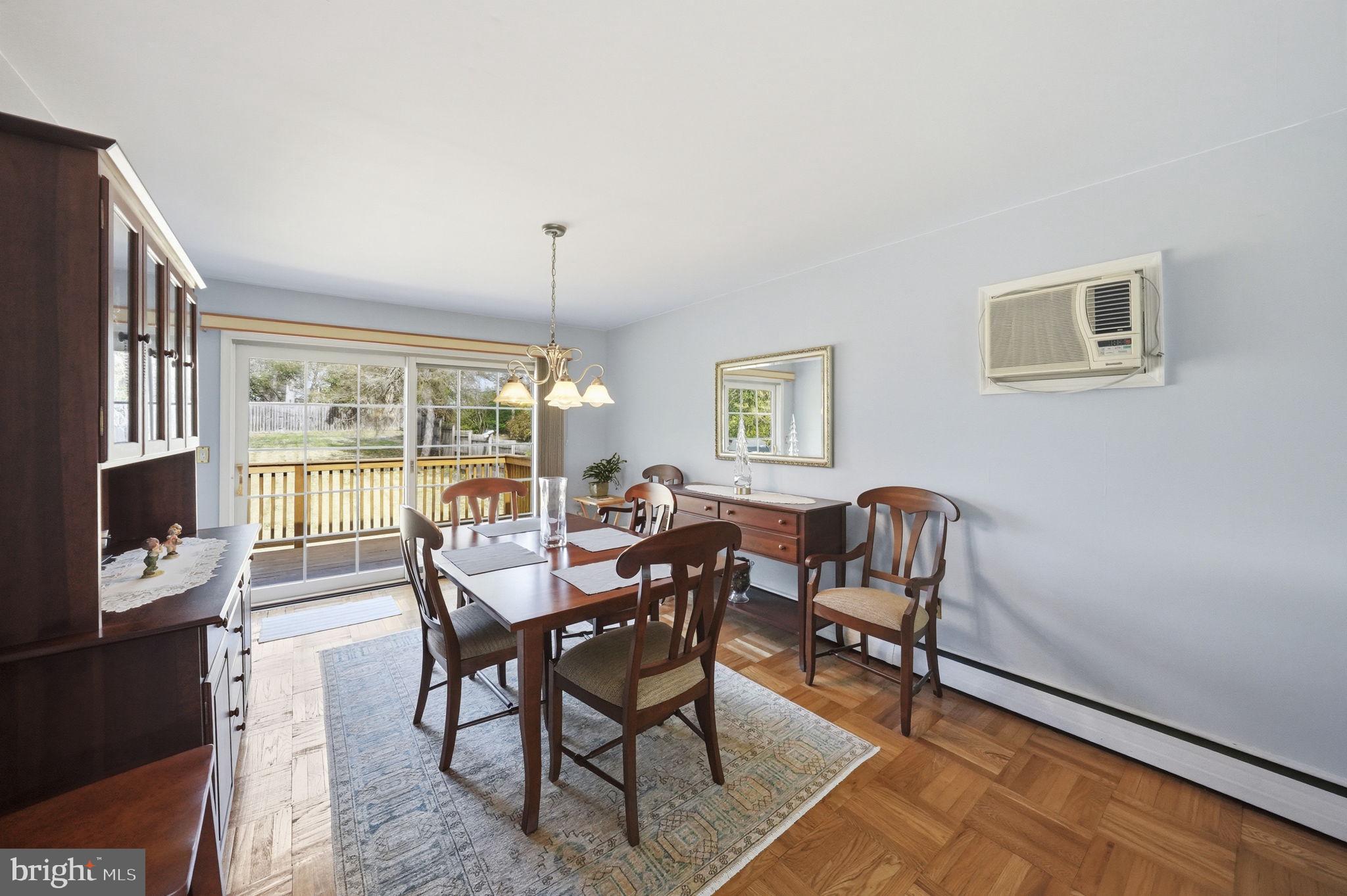 28 Green Ridge Road Yardley, PA 19067 - Photo 13 of 49 a dining room with furniture a chandelier and wooden floor