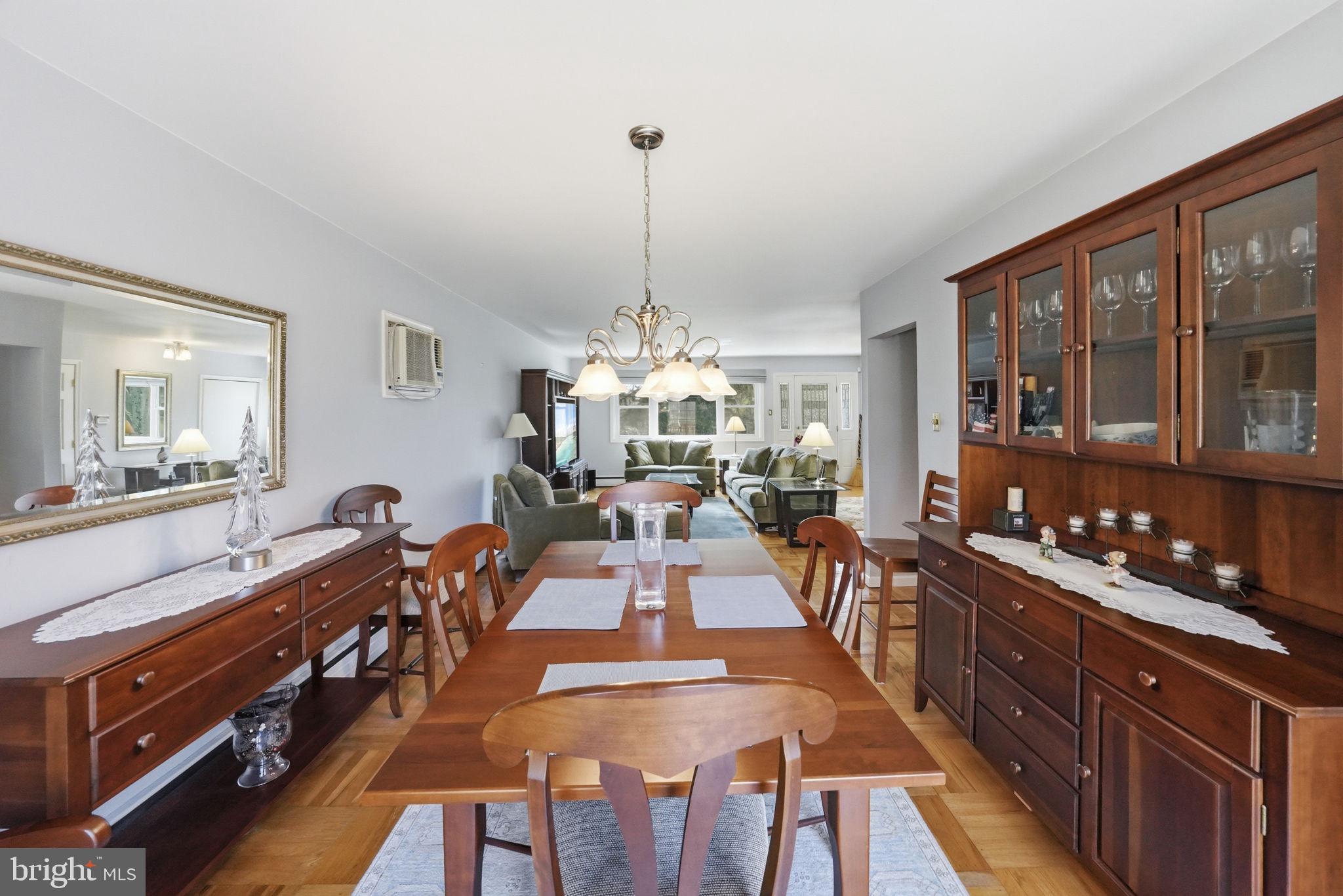 28 Green Ridge Road Yardley, PA 19067 - Photo 14 of 49 a view of a dining room and livingroom with furniture a chandelier