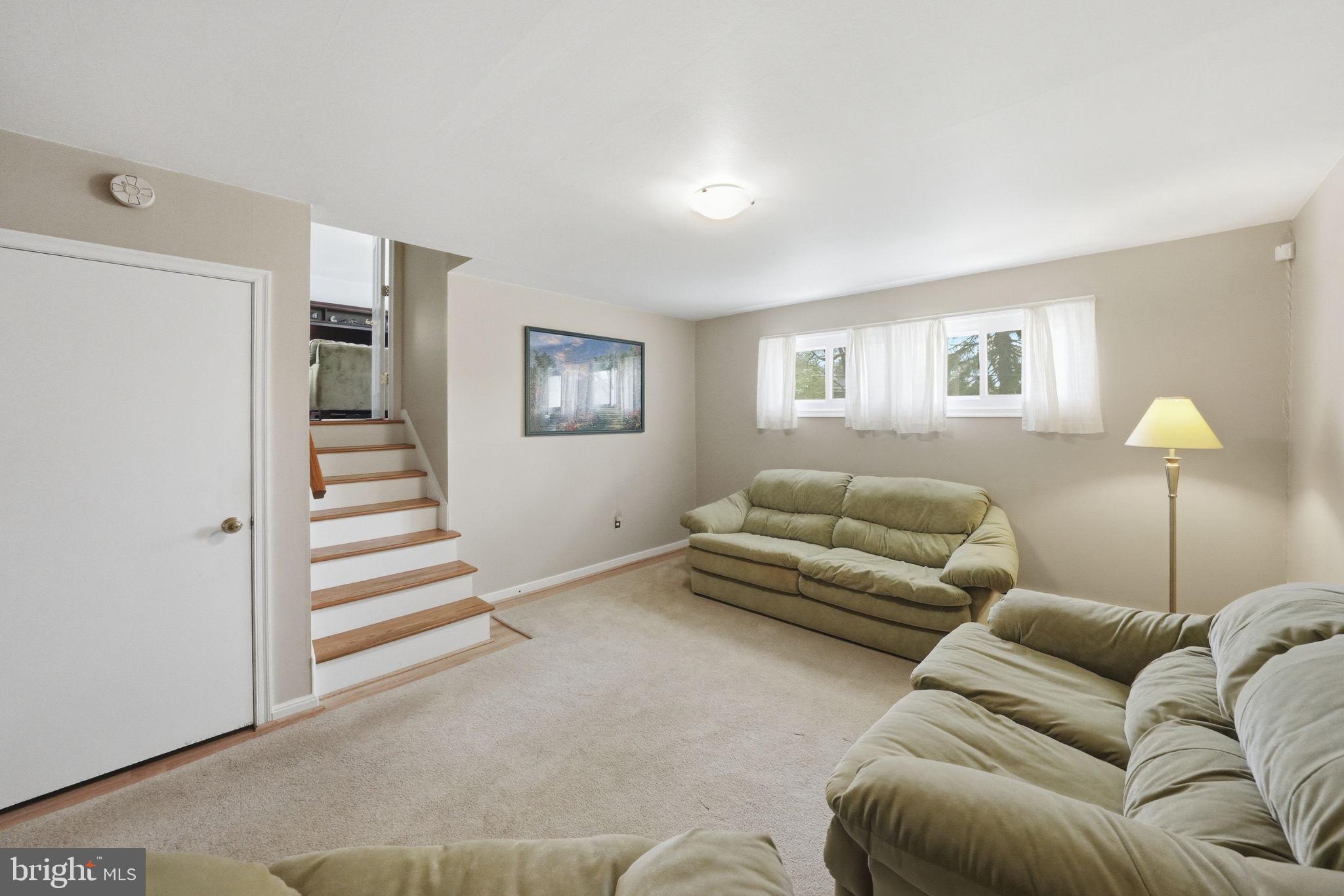 28 Green Ridge Road Yardley, PA 19067 - Photo 23 of 49 a bedroom with furniture and a lamp