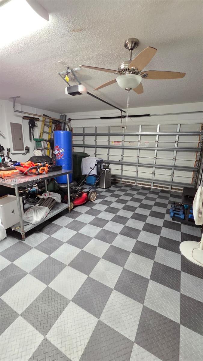 1308 Alexander Bend Weston, FL 33327 - Photo 29 of 54 a room with gym equipment and a table