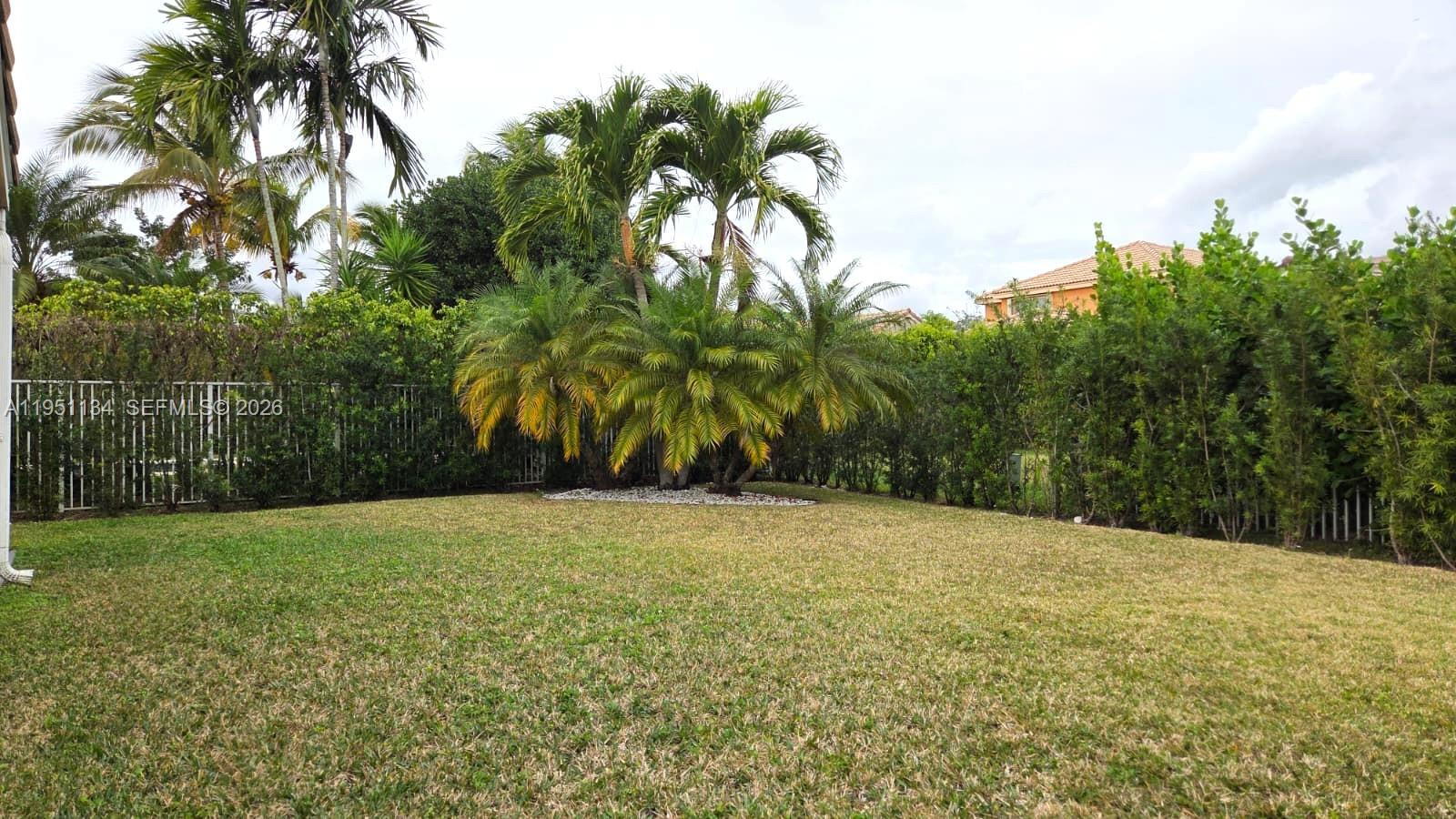 1308 Alexander Bend Weston, FL 33327 - Photo 35 of 54 a view of a field with a tree