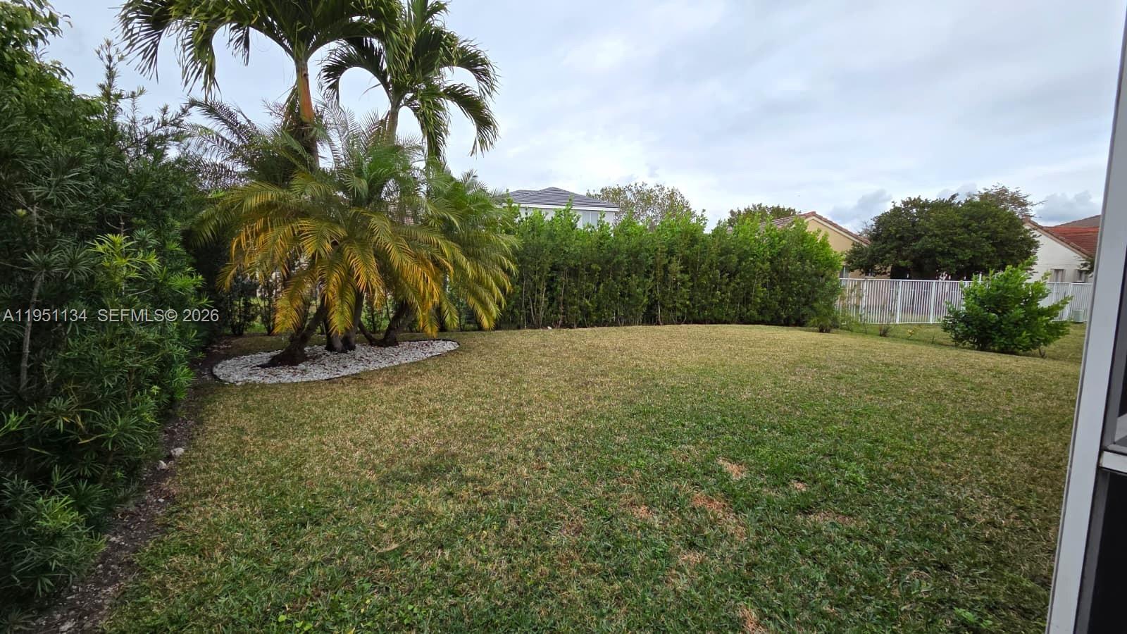 1308 Alexander Bend Weston, FL 33327 - Photo 39 of 54 a view of backyard with outdoor space