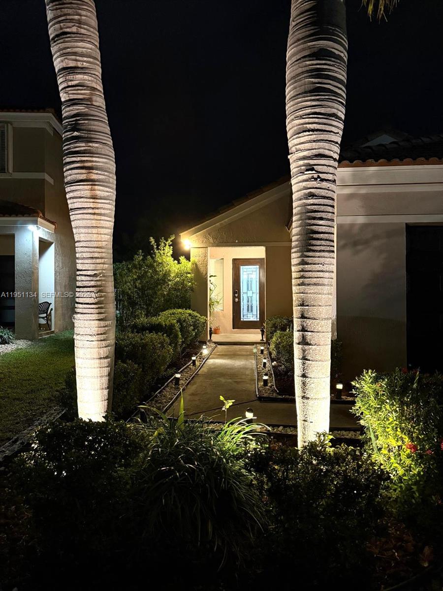 1308 Alexander Bend Weston, FL 33327 - Photo 41 of 54 a view of a house with backyard and garden