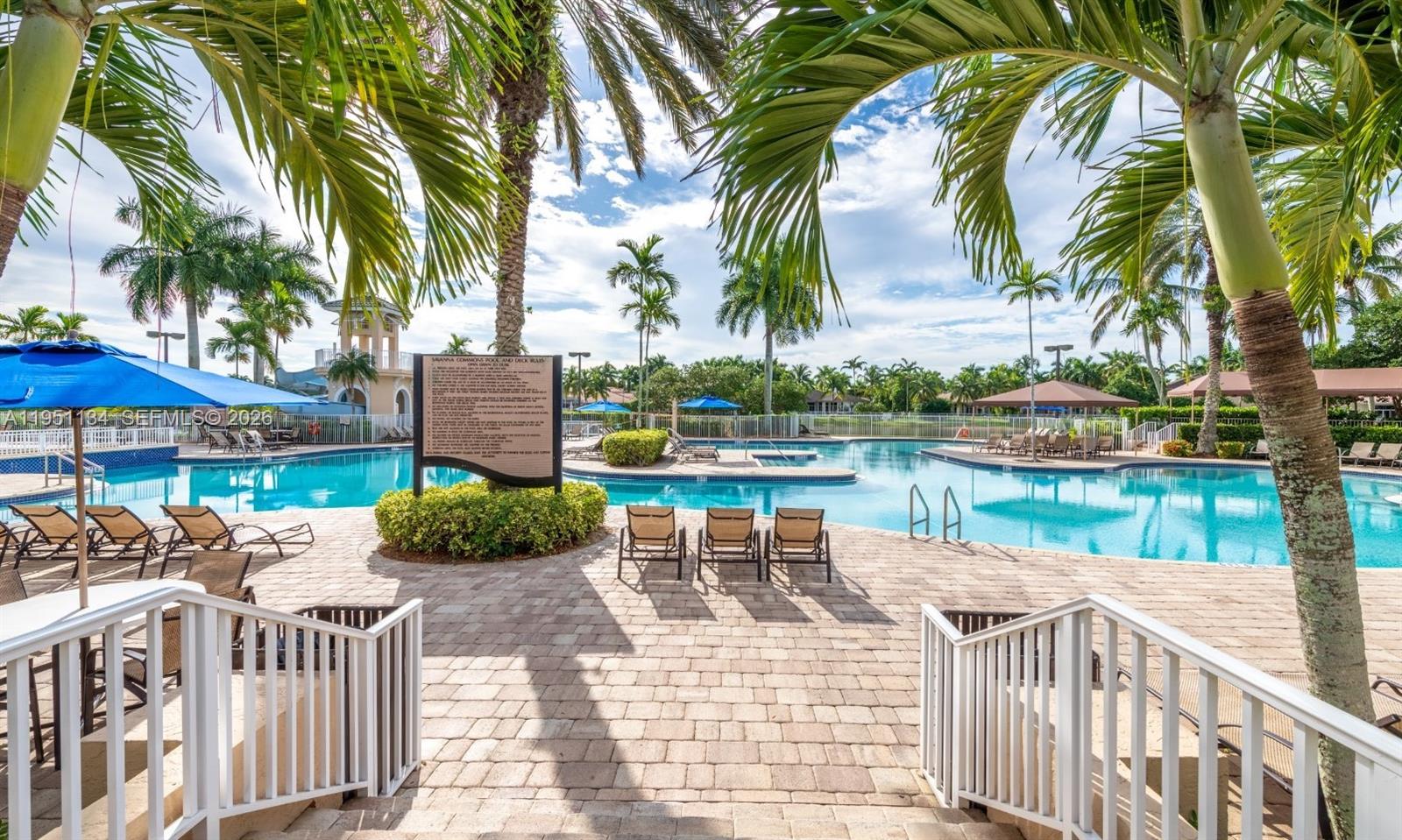 1308 Alexander Bend Weston, FL 33327 - Photo 48 of 54 a view of swimming pool with outdoor seating and plants