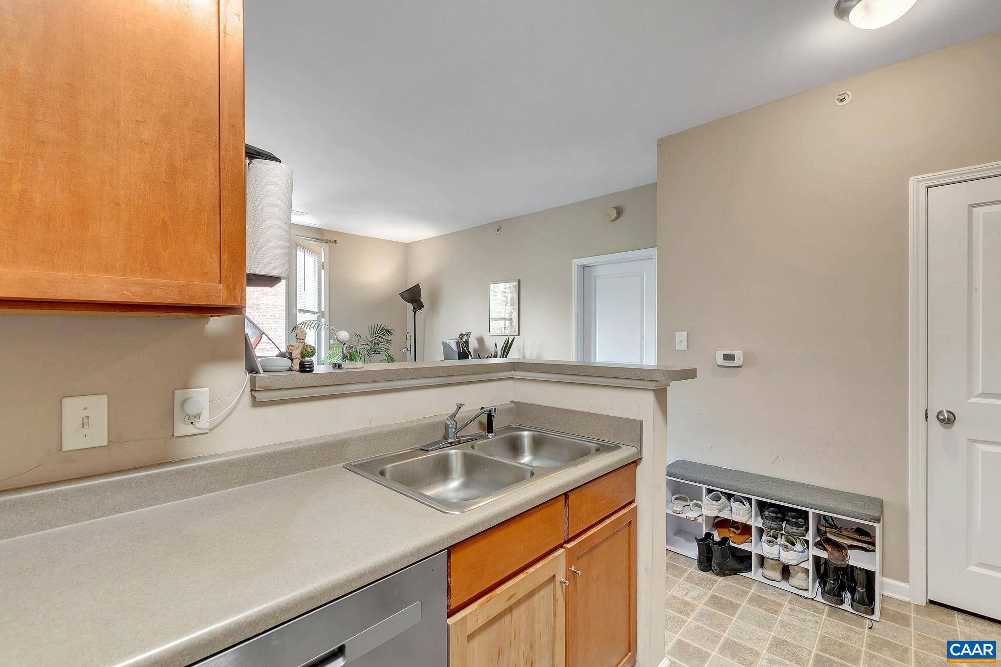 745 Walker Square, Unit 3C Charlottesville, VA 22903 - Photo 2 of 10 a view of a sink a mirror and cabinets