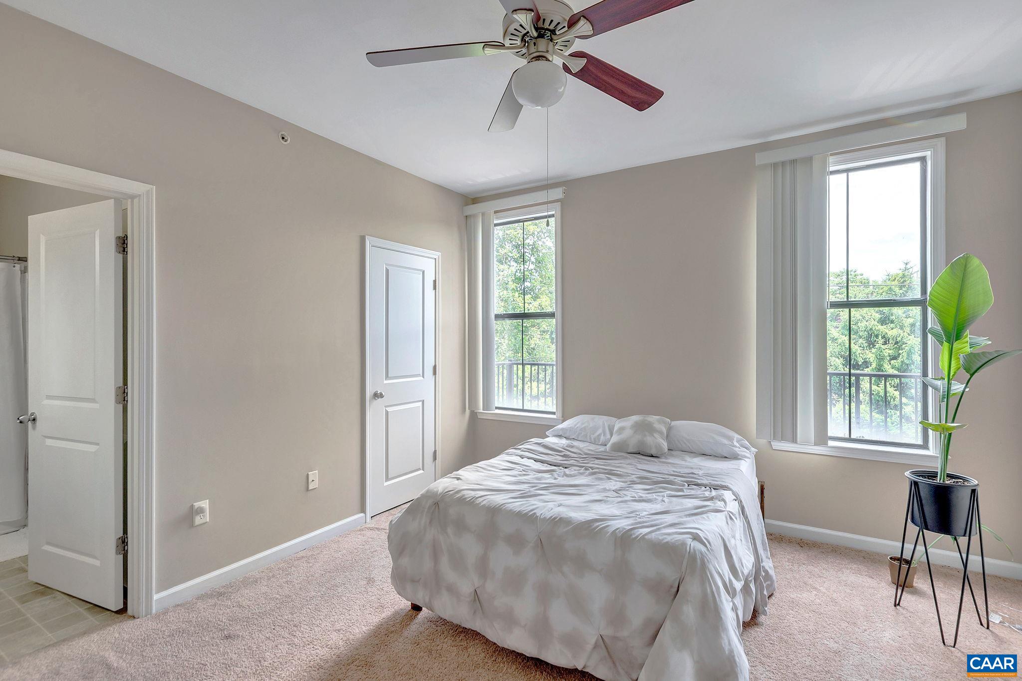 745 Walker Square, Unit 3C Charlottesville, VA 22903 - Photo 6 of 10 a bedroom with a bed and a window