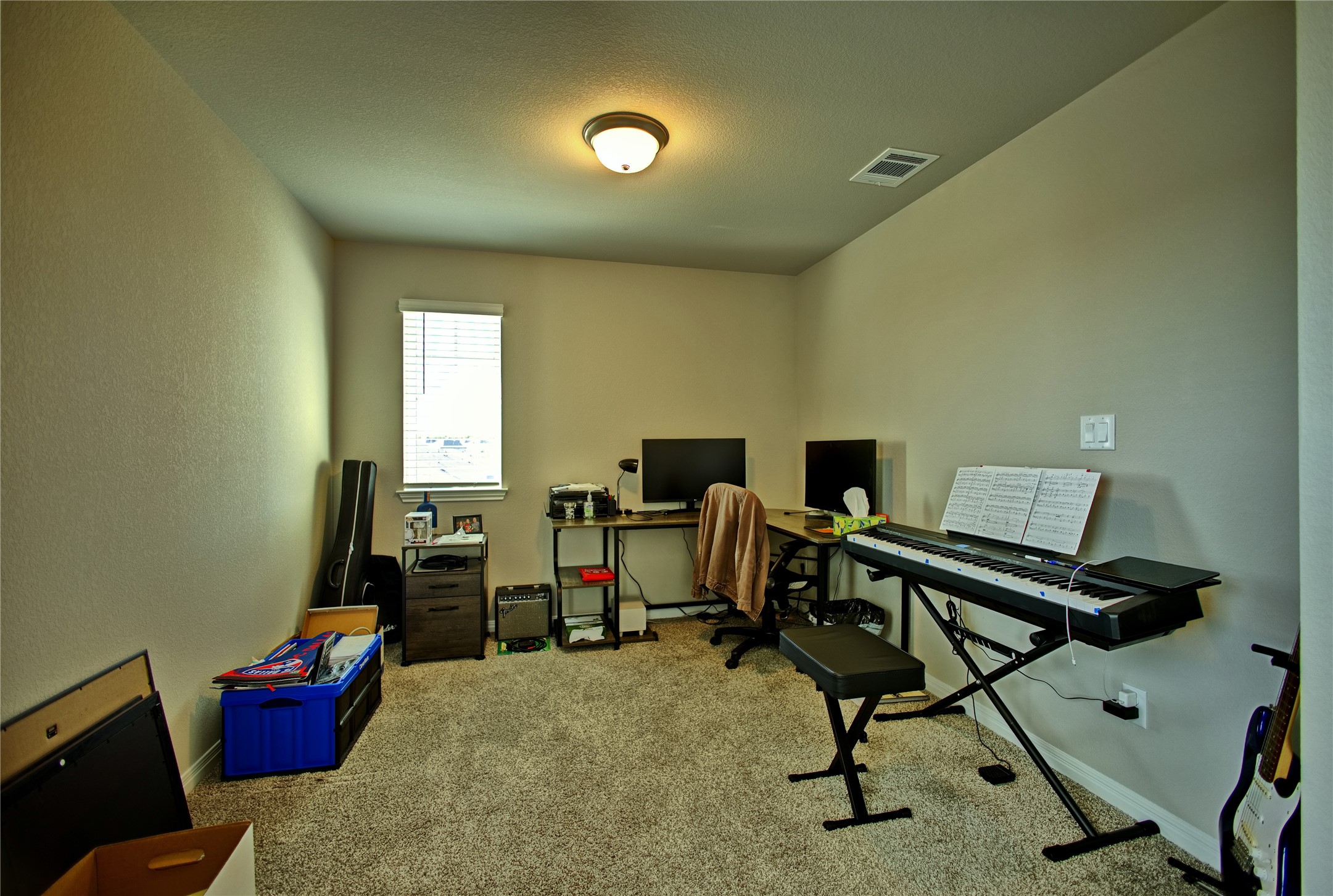 2809 Moyer Lane Round Rock, TX 78665 - Photo 17 of 22 Office space with light colored carpet and a textured ceiling