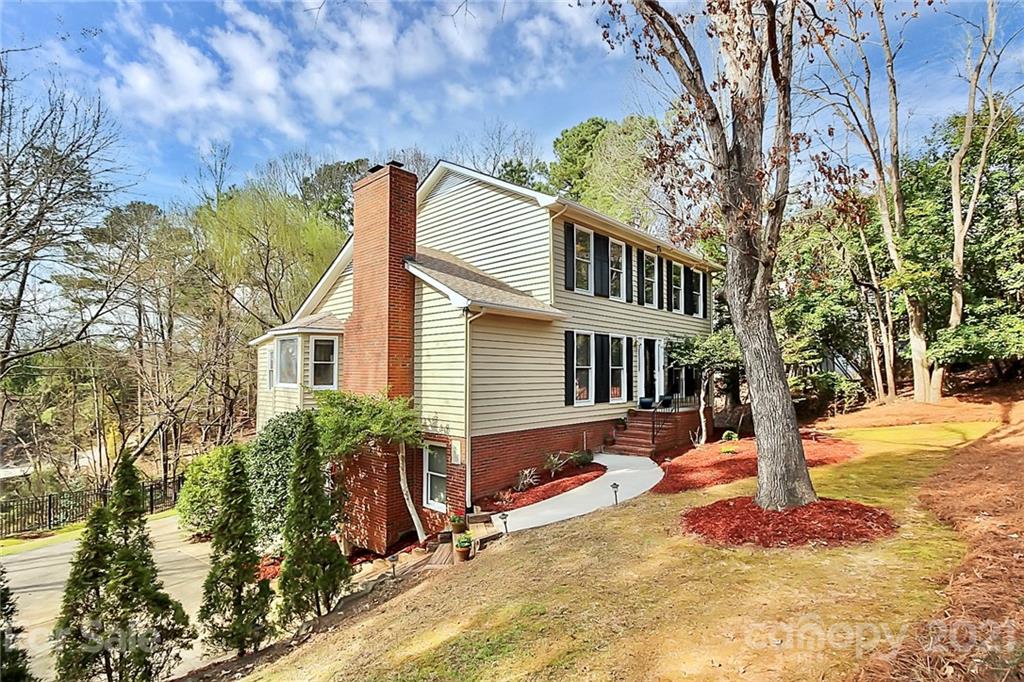 29032 Snapper Point Tega Cay, SC 29708 - Photo 2 of 48 a front view of a house with a yard