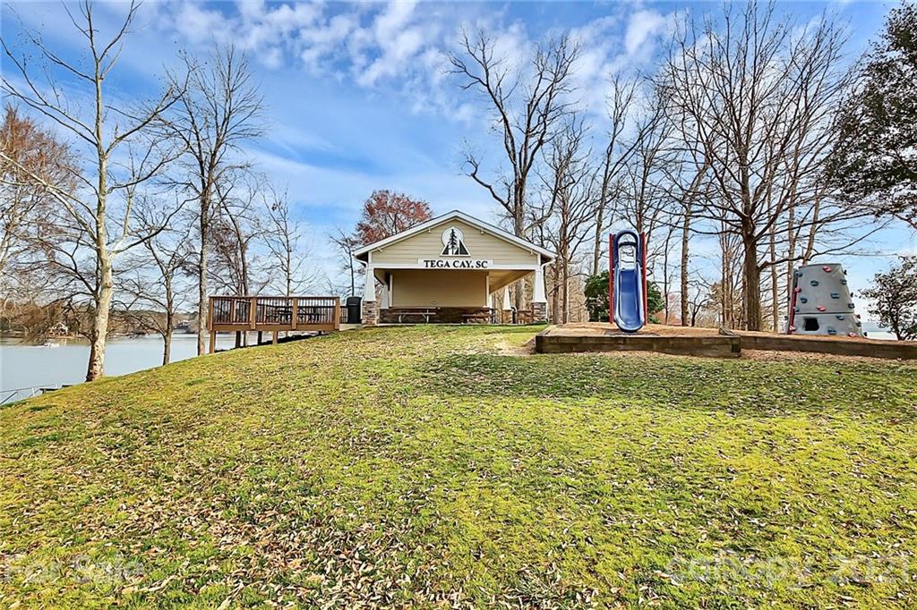 29032 Snapper Point Tega Cay, SC 29708 - Photo 38 of 48 a large pool with lawn chairs yard