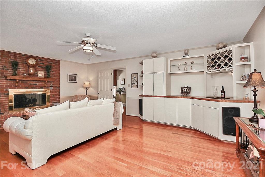 29032 Snapper Point Tega Cay, SC 29708 - Photo 5 of 48 a living room with furniture and a fireplace