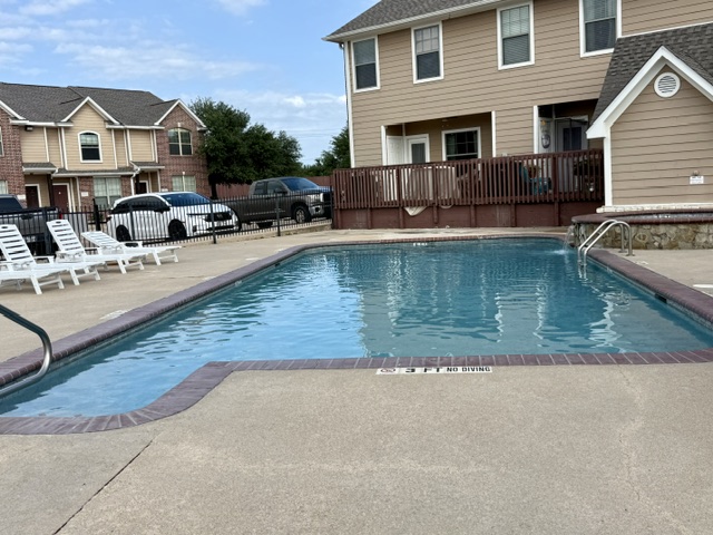 1000 Spring Loop, Unit 1806 College Station, TX 77840 - Photo 33 of 33 a view of a house with swimming pool