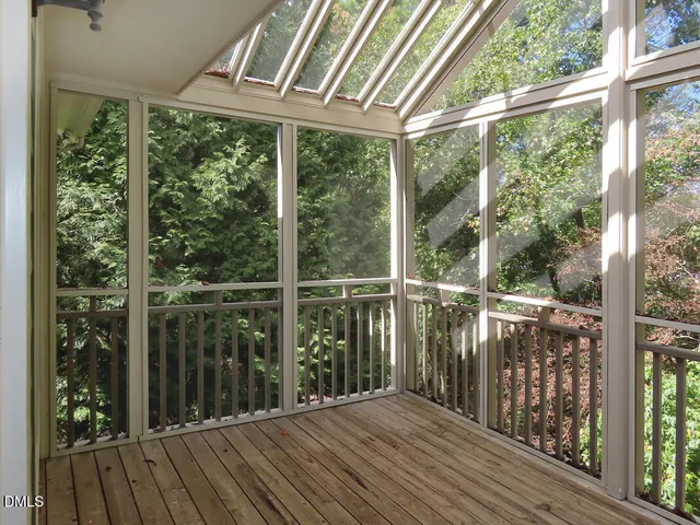 a view of a balcony with wooden floor