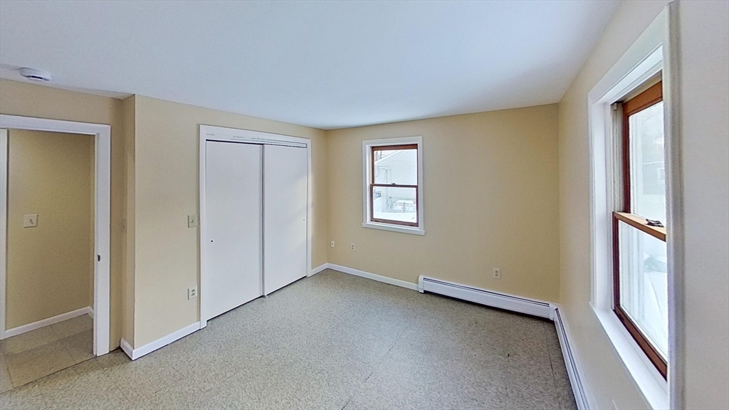 52 Rockefeller Street, Unit 2 Randolph, MA 02368 - Photo 6 of 9 a view of an empty room with a window