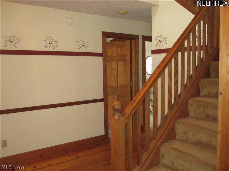 2648 Johnnycake Road Mogadore, OH 44260 - Photo 8 of 25 Front hall leads to bedroom and kitchen