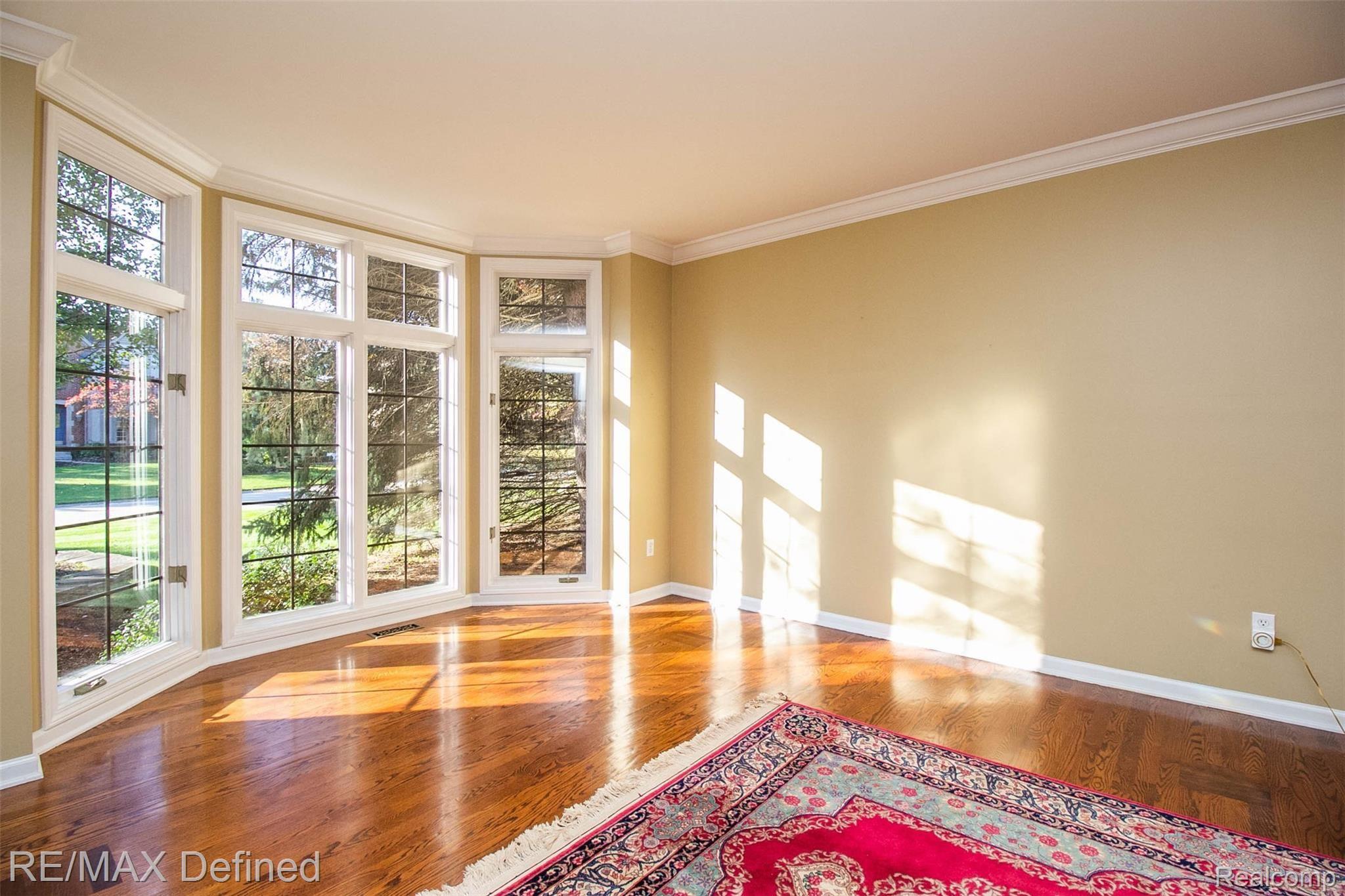 3701 Edinborough Drive Rochester, MI 48306 - Photo 4 of 26 Living room with custom wood inlays & bow window