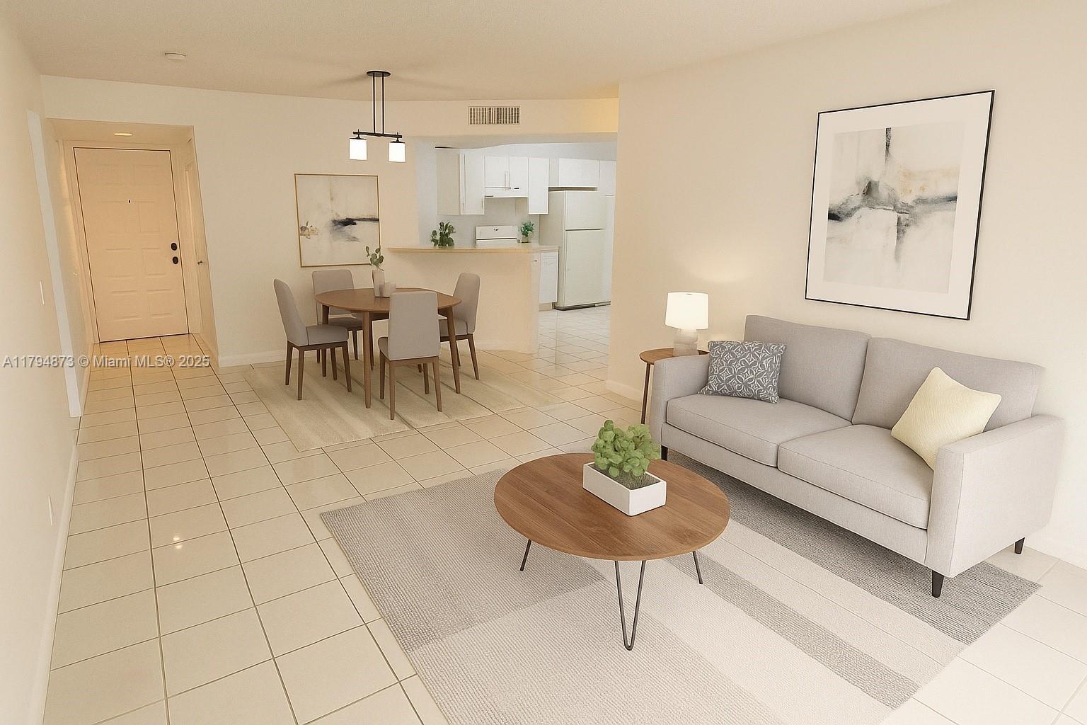a living room with furniture and a dining table with kitchen view