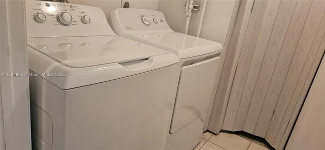 a bathroom with a granite countertop toilet a sink and mirror