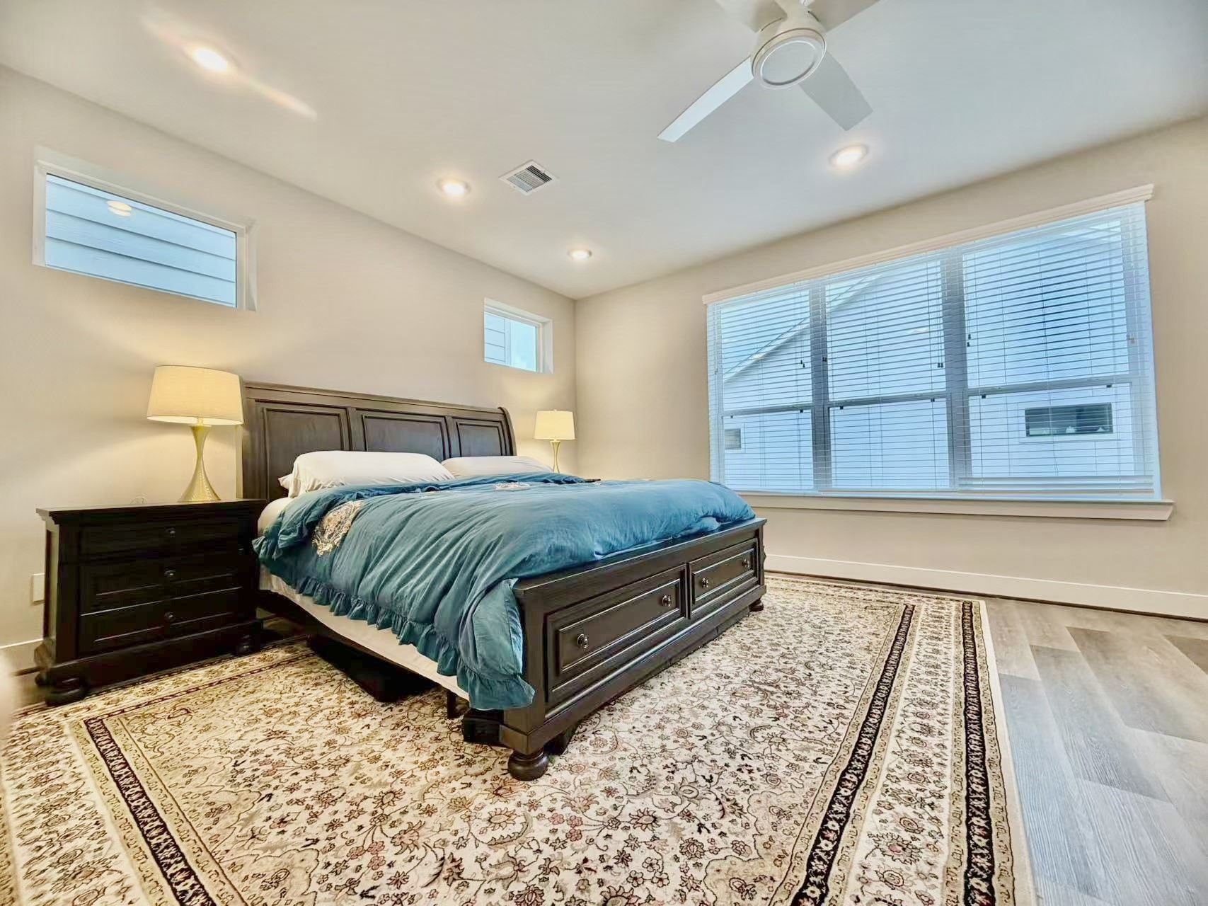 1254 North Post Oak Road, Unit B Houston, TX 77055 - Photo 11 of 25 a bedroom with a bed and wooden floor