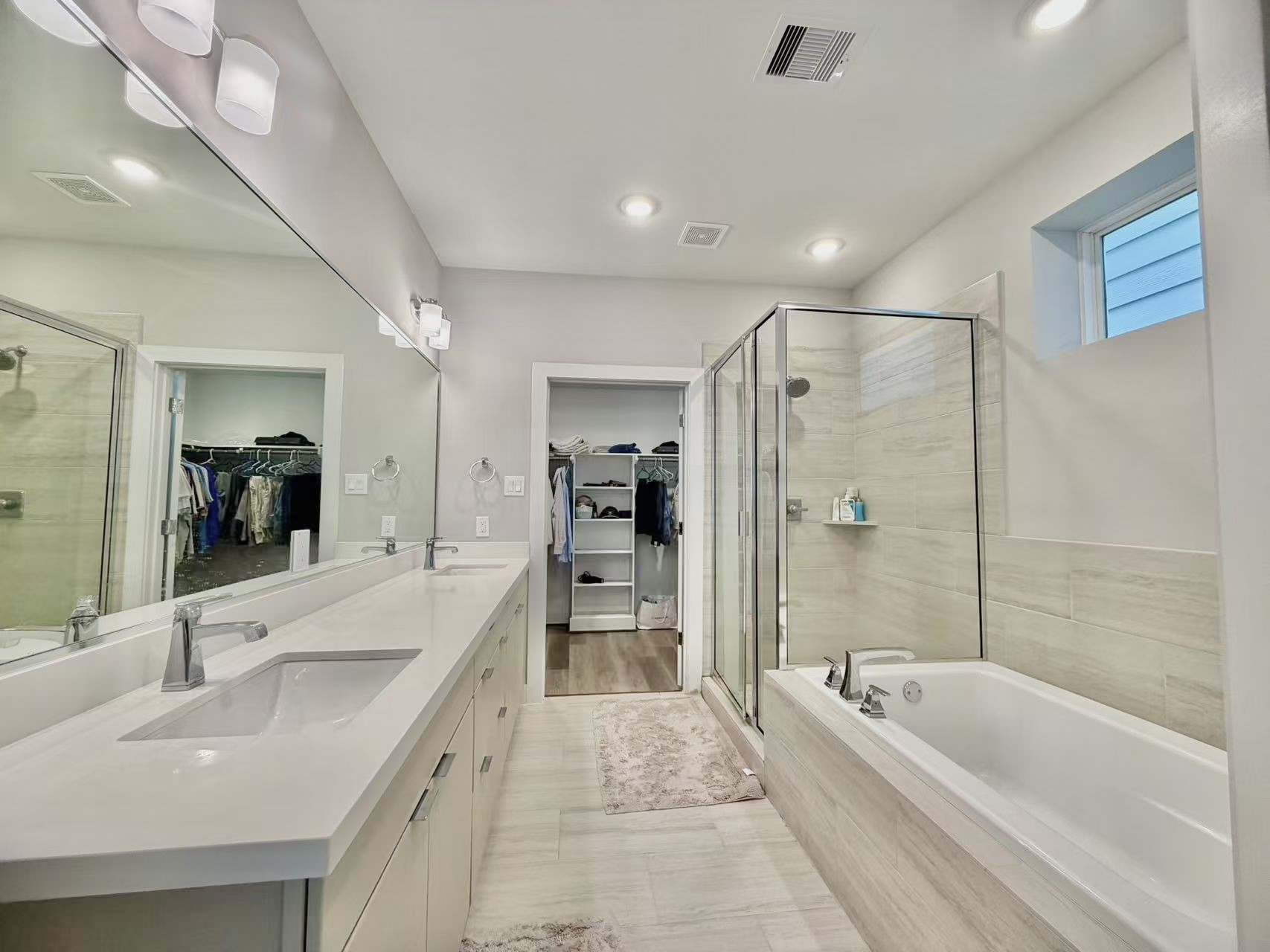 1254 North Post Oak Road, Unit B Houston, TX 77055 - Photo 12 of 25 a large spacious bathroom with a granite countertop tub sink shower and a mirror