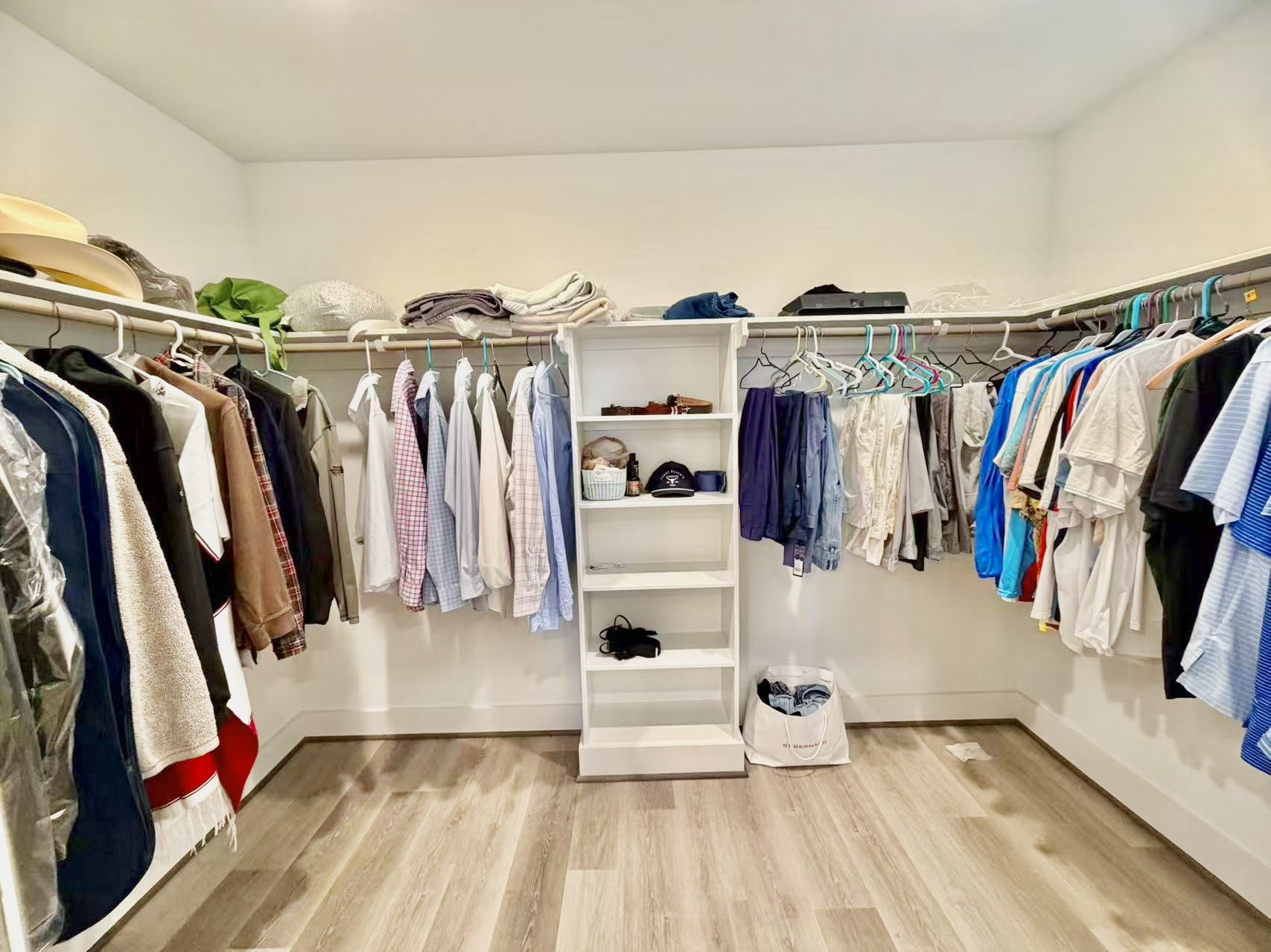 1254 North Post Oak Road, Unit B Houston, TX 77055 - Photo 13 of 25 a view of walk in closet with clothes and shoes