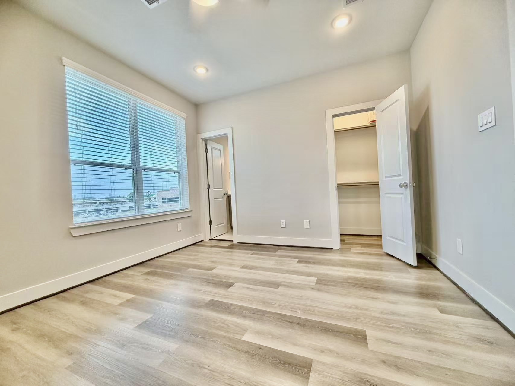 1254 North Post Oak Road, Unit B Houston, TX 77055 - Photo 17 of 25 a view of an empty room with window and closet area