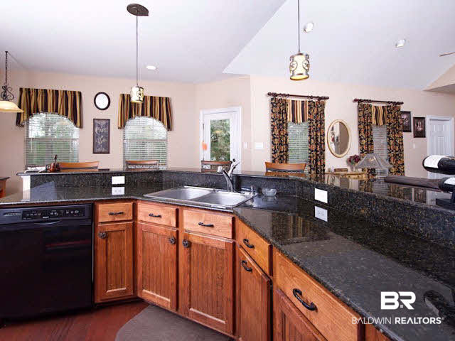9380 Greenleaf Drive Daphne, AL 36527 - Photo 13 of 24 Gourmet Kitchen with breakfast bar, breakfast nook, cook top, double ovens, and tons of prep and storage space!
