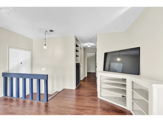 a view of a livingroom with wooden floor