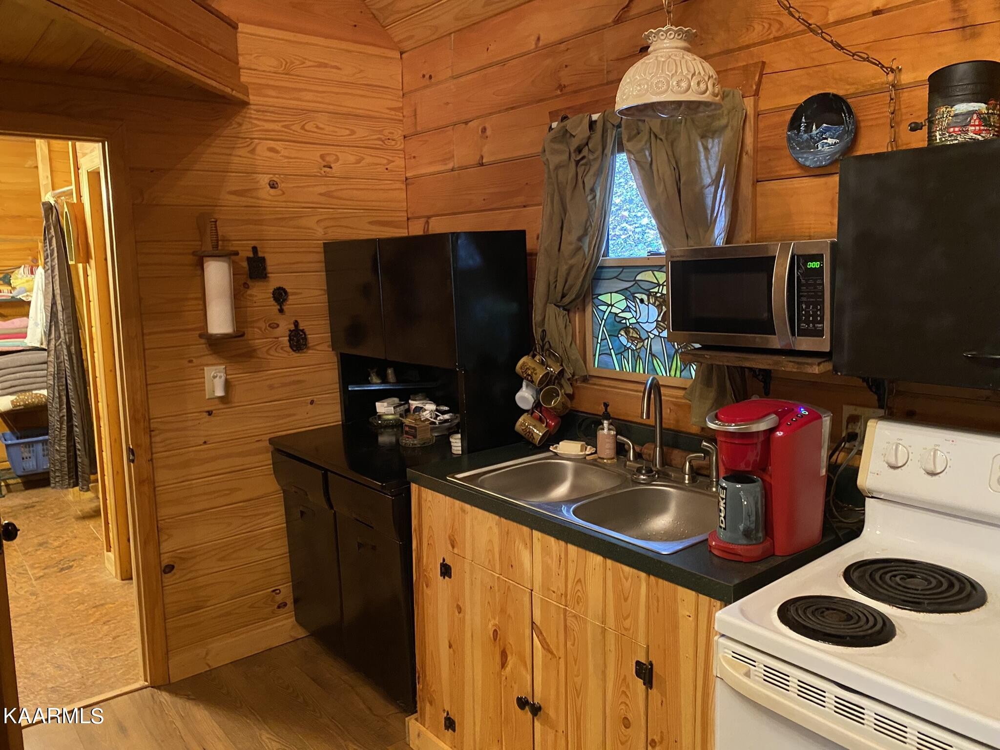 755 Compton Bottom Drive Jamestown, TN 38556 - Photo 9 of 24 a kitchen with a sink a stove and a microwave