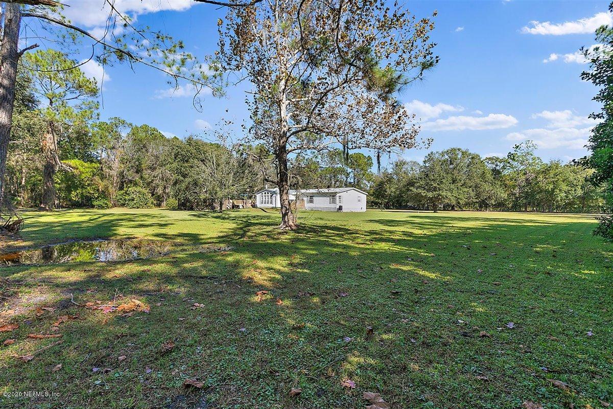 2987 Green Acres Road St. Augustine, FL 32084 - Photo 27 of 31 a view of a golf course with a big yard