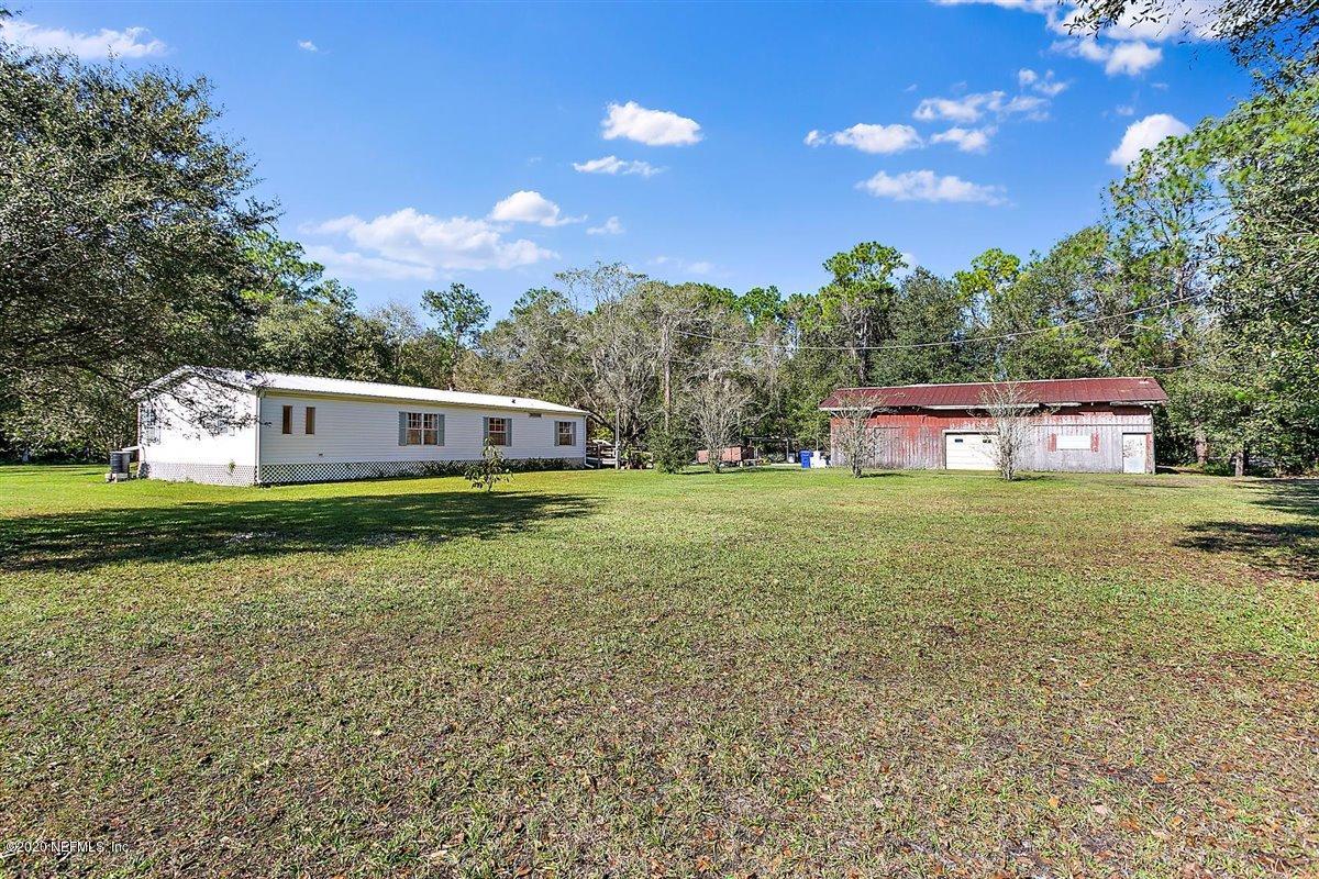2987 Green Acres Road St. Augustine, FL 32084 - Photo 28 of 31 a front view of a house with garden
