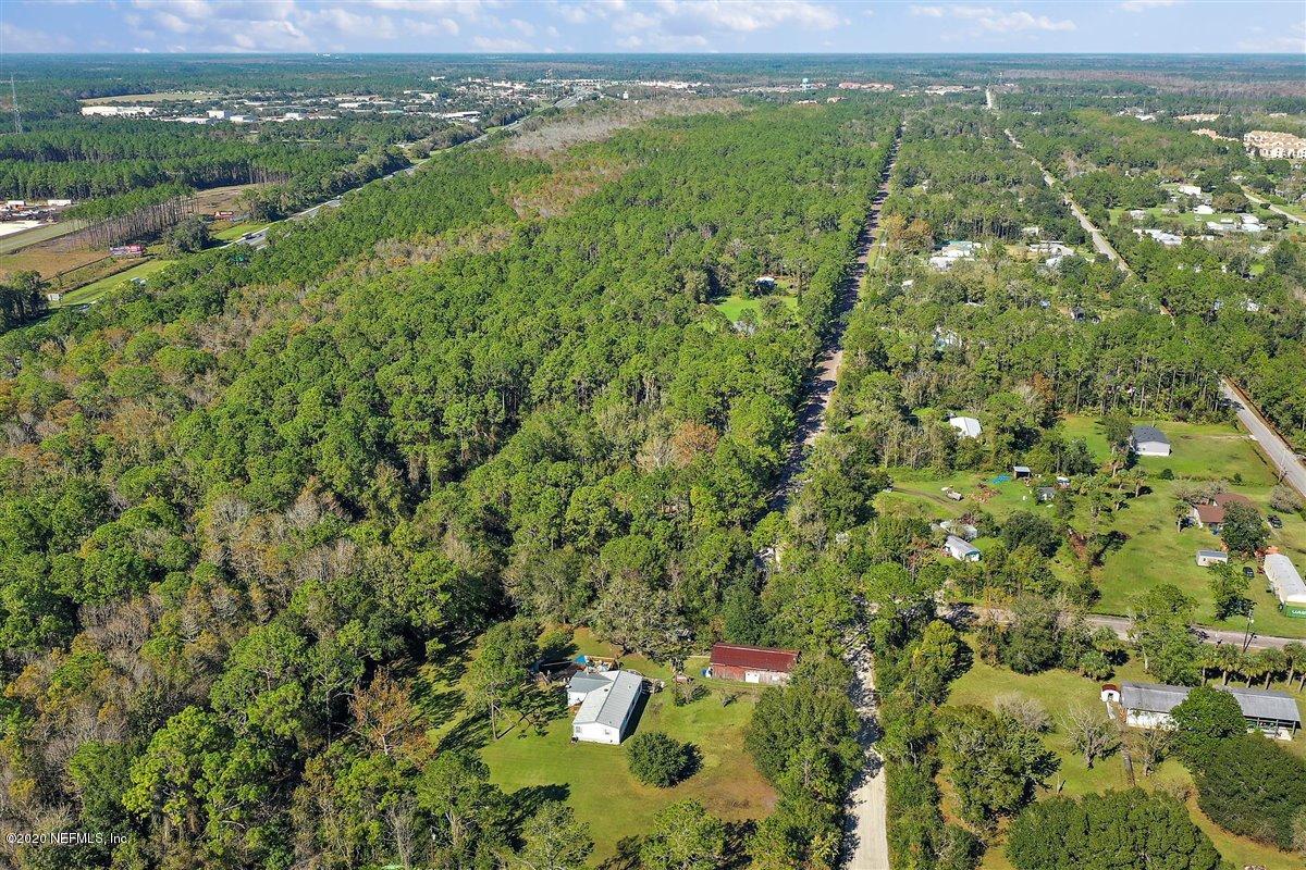 2987 Green Acres Road St. Augustine, FL 32084 - Photo 30 of 31 a view of a city with lush green forest