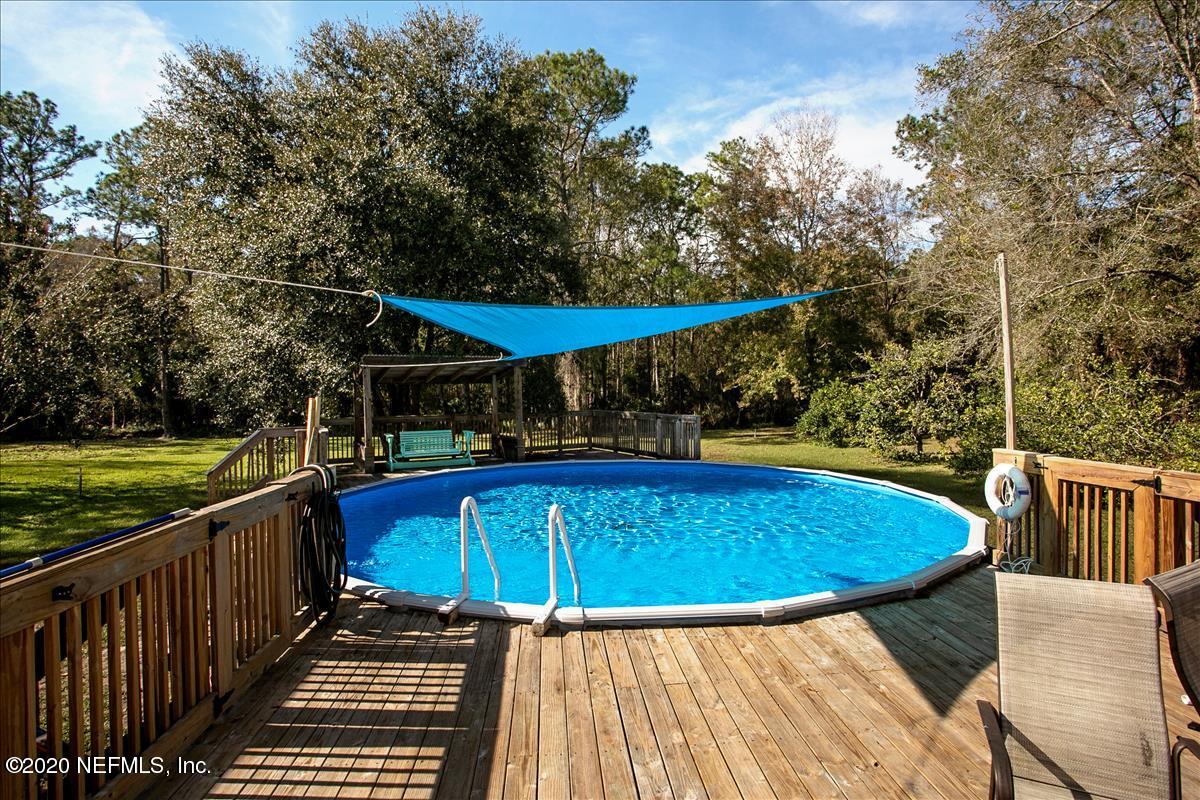 2987 Green Acres Road St. Augustine, FL 32084 - Photo 3 of 31 a view of balcony with wooden floor and outdoor seating