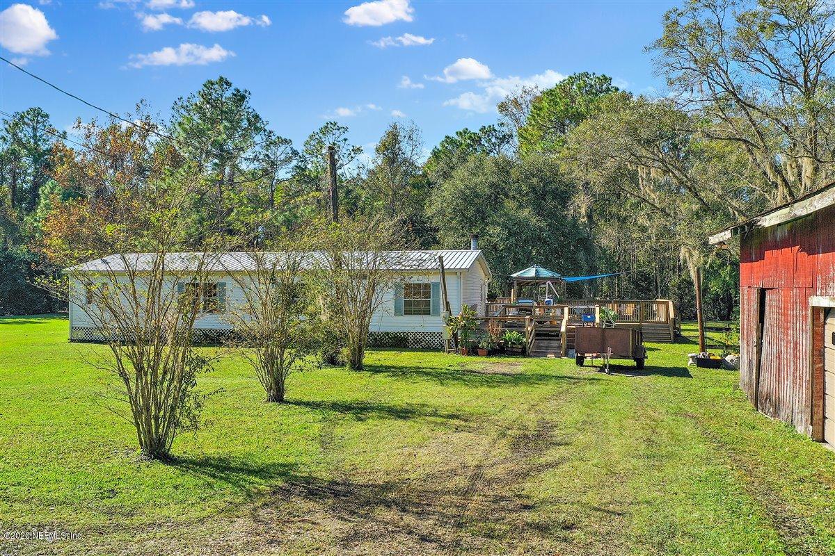 2987 Green Acres Road St. Augustine, FL 32084 - Photo 31 of 31 a view of a house with a yard