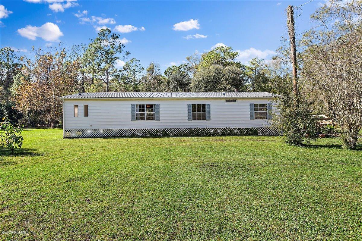 2987 Green Acres Road St. Augustine, FL 32084 - Photo 4 of 31 a view of a house with a backyard