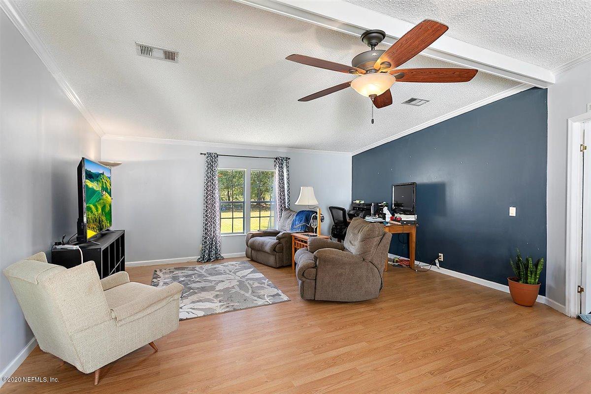 2987 Green Acres Road St. Augustine, FL 32084 - Photo 5 of 31 a living room with furniture and a window
