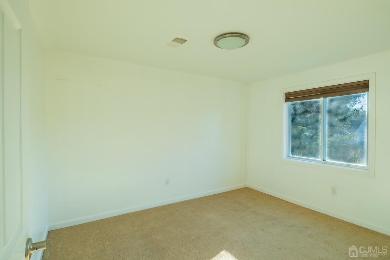 95 Tunison Road New Brunswick, NJ 08901 - Photo 15 of 29 a view of an empty room with a window