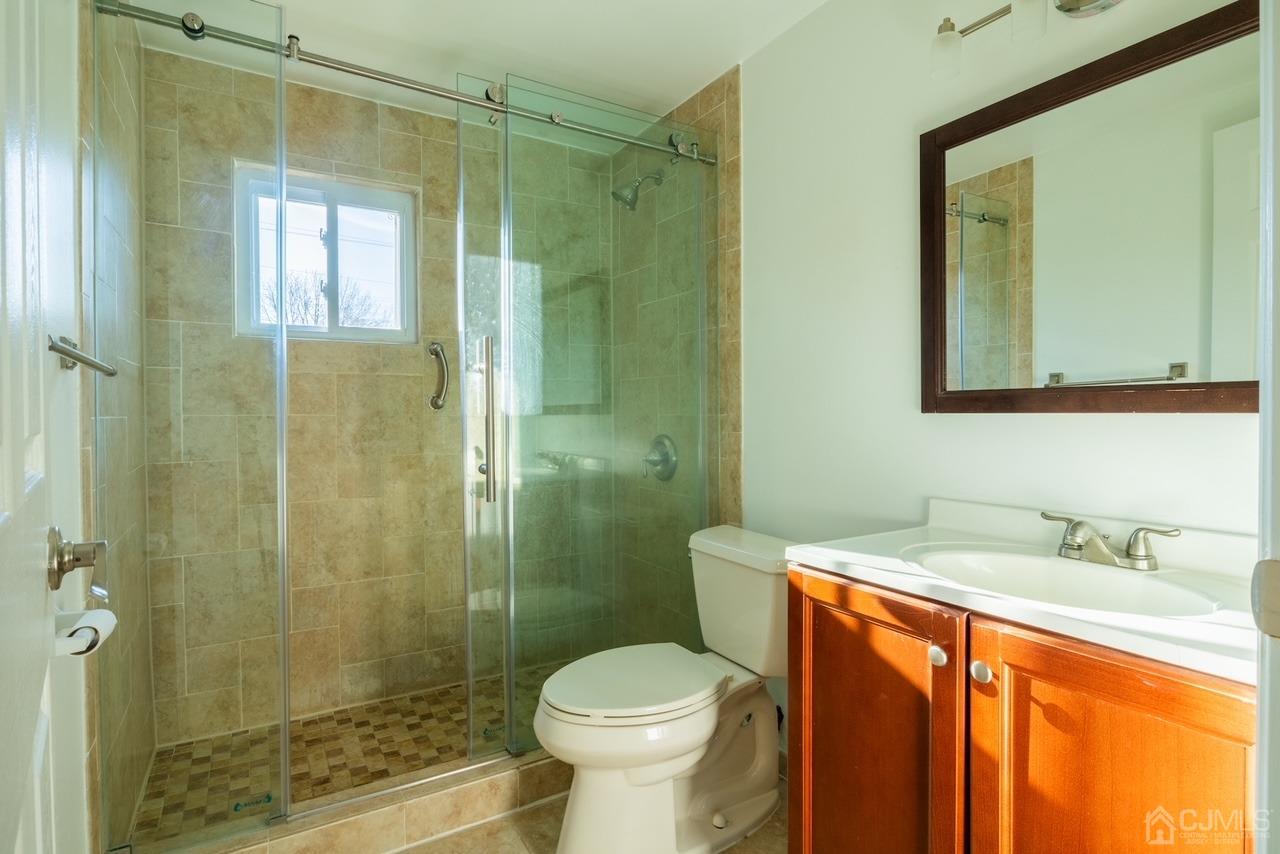 95 Tunison Road New Brunswick, NJ 08901 - Photo 16 of 29 a bathroom with a sink toilet and shower