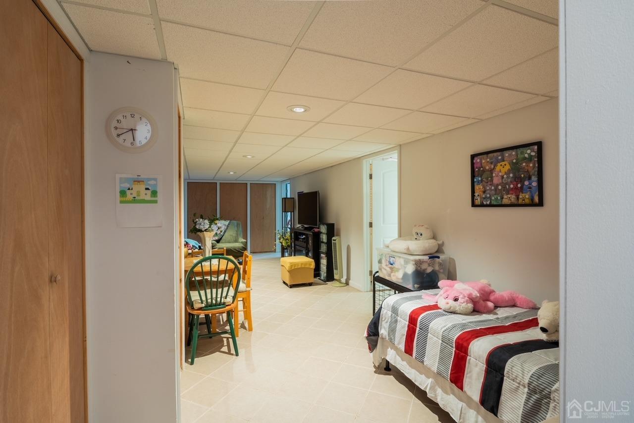 95 Tunison Road New Brunswick, NJ 08901 - Photo 18 of 29 a bedroom with a bed and a couch