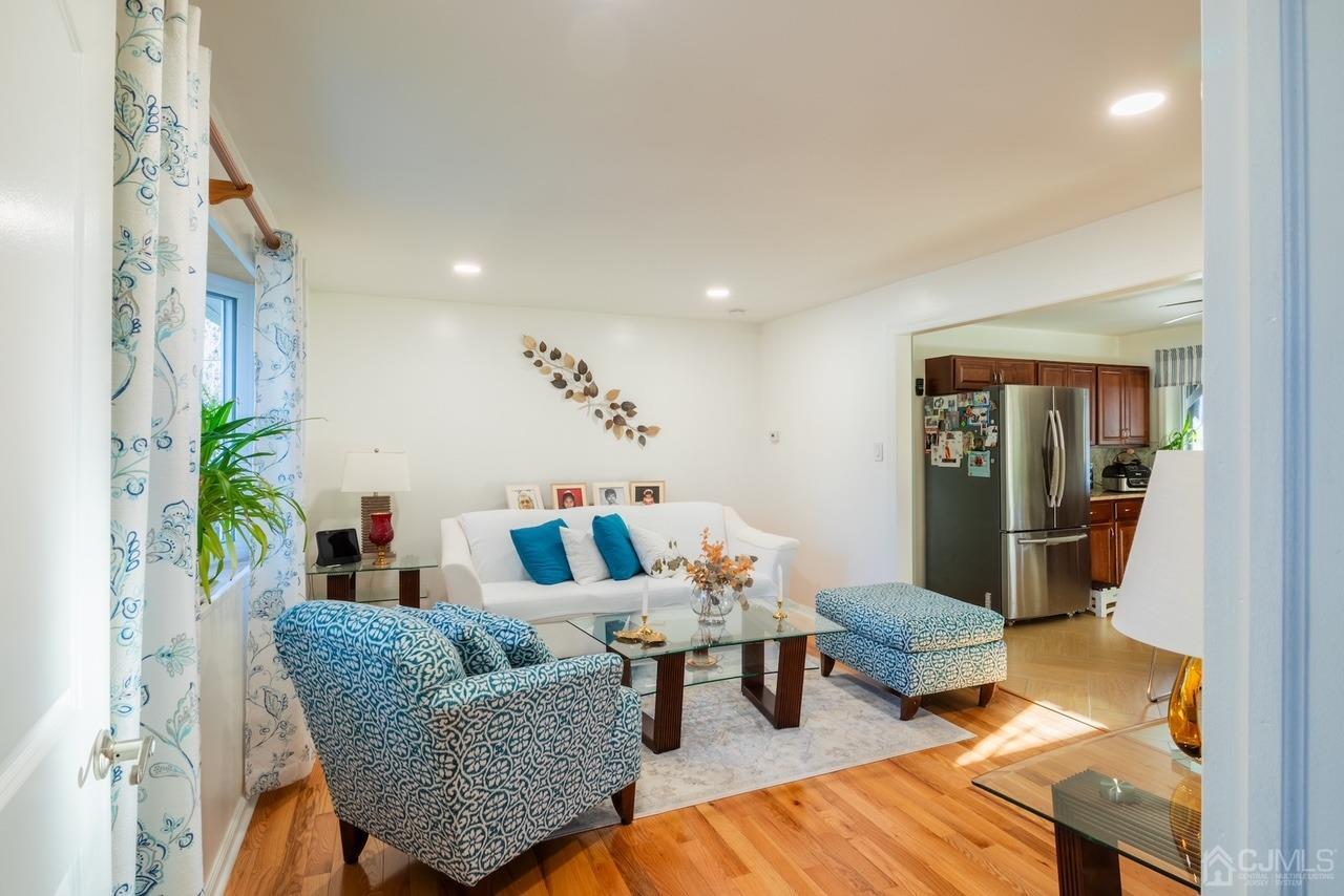95 Tunison Road New Brunswick, NJ 08901 - Photo 3 of 29 a living room with furniture and wooden floor