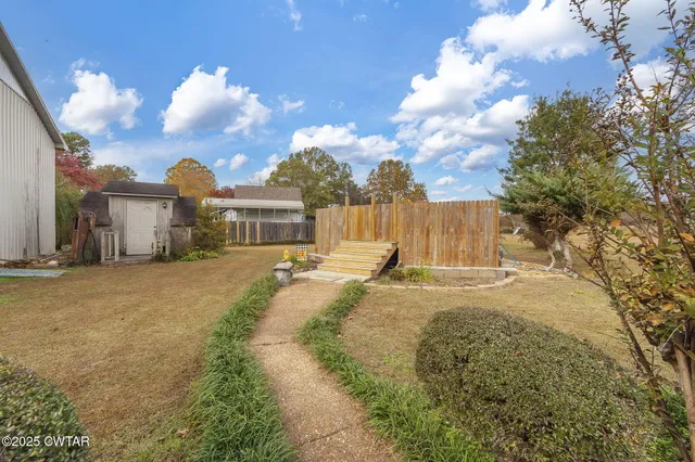 a view of a house with basketball court