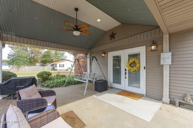 a view of a porch with furniture and a window