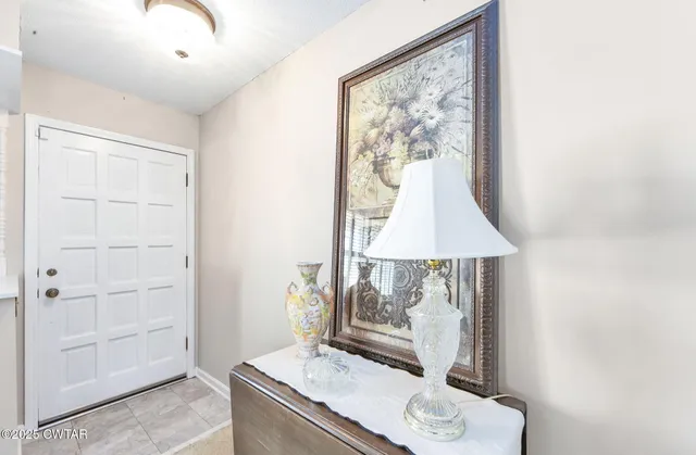 a room with a table and a mirror