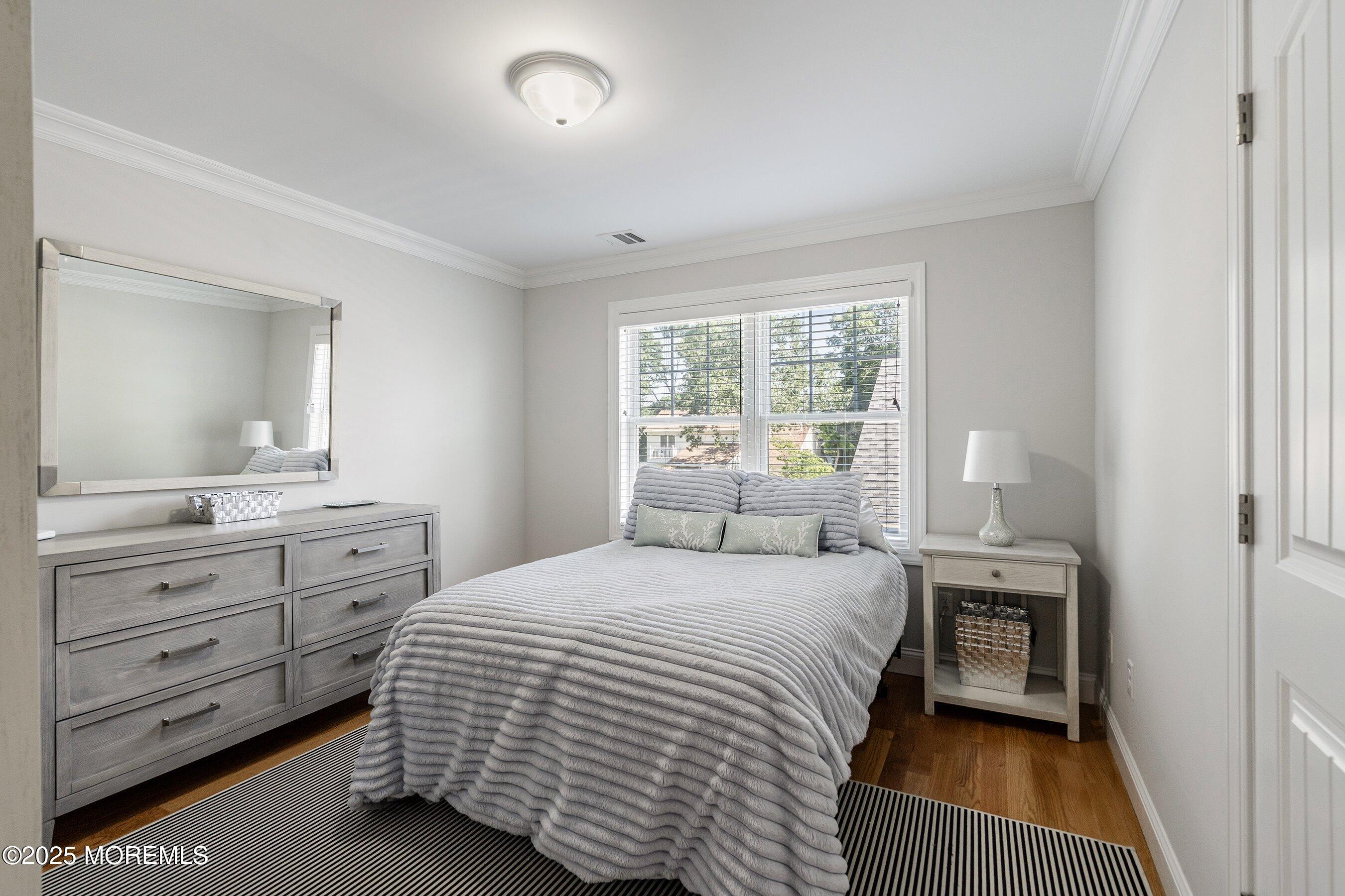 309 Hall Avenue Point Pleasant, NJ 08742 - Photo 18 of 35 a bedroom with a bed and a dresser