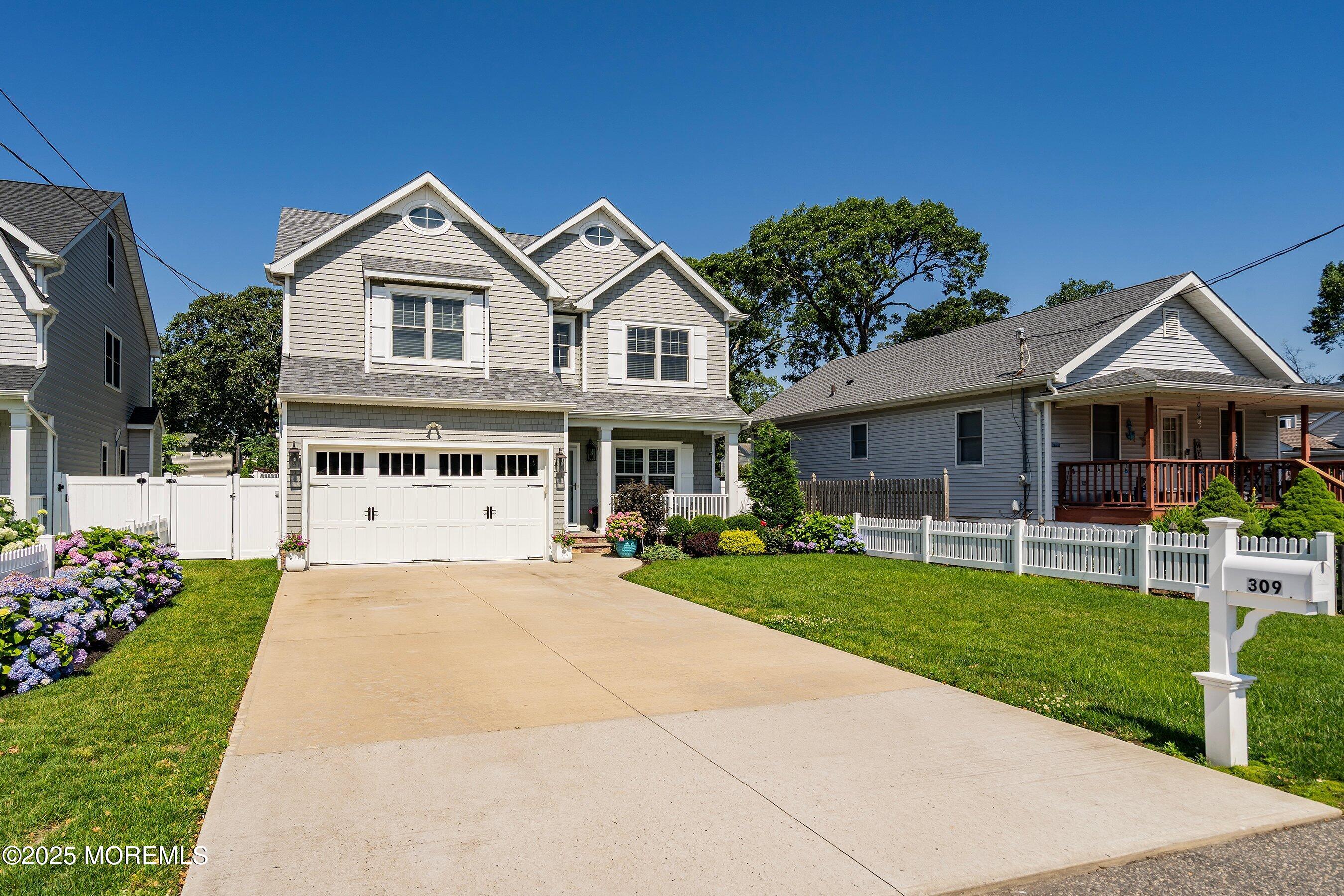 309 Hall Avenue Point Pleasant, NJ 08742 - Photo 2 of 35 a front view of a house with a garden and yard