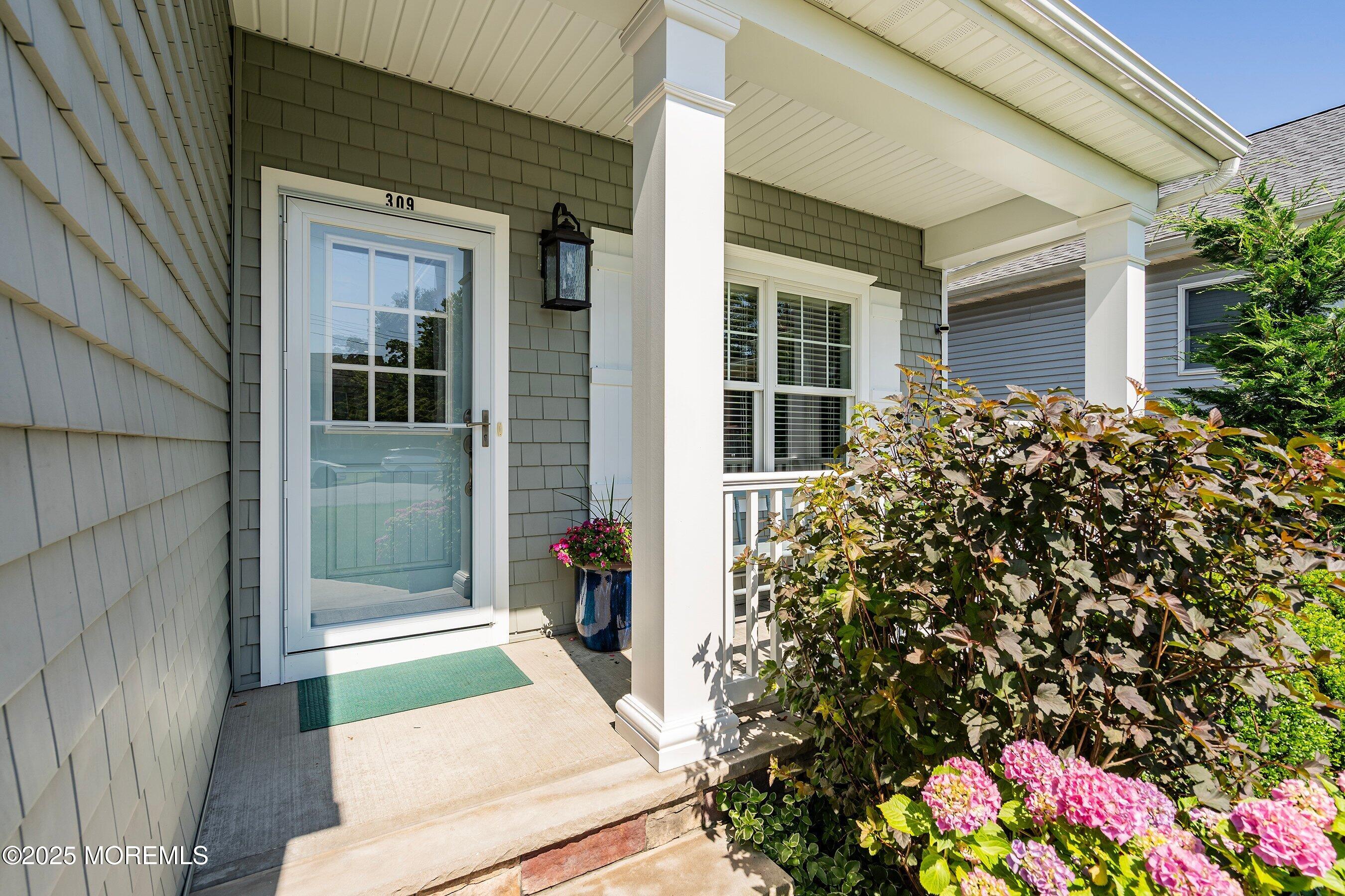 309 Hall Avenue Point Pleasant, NJ 08742 - Photo 3 of 35 a front view of a house with a porch